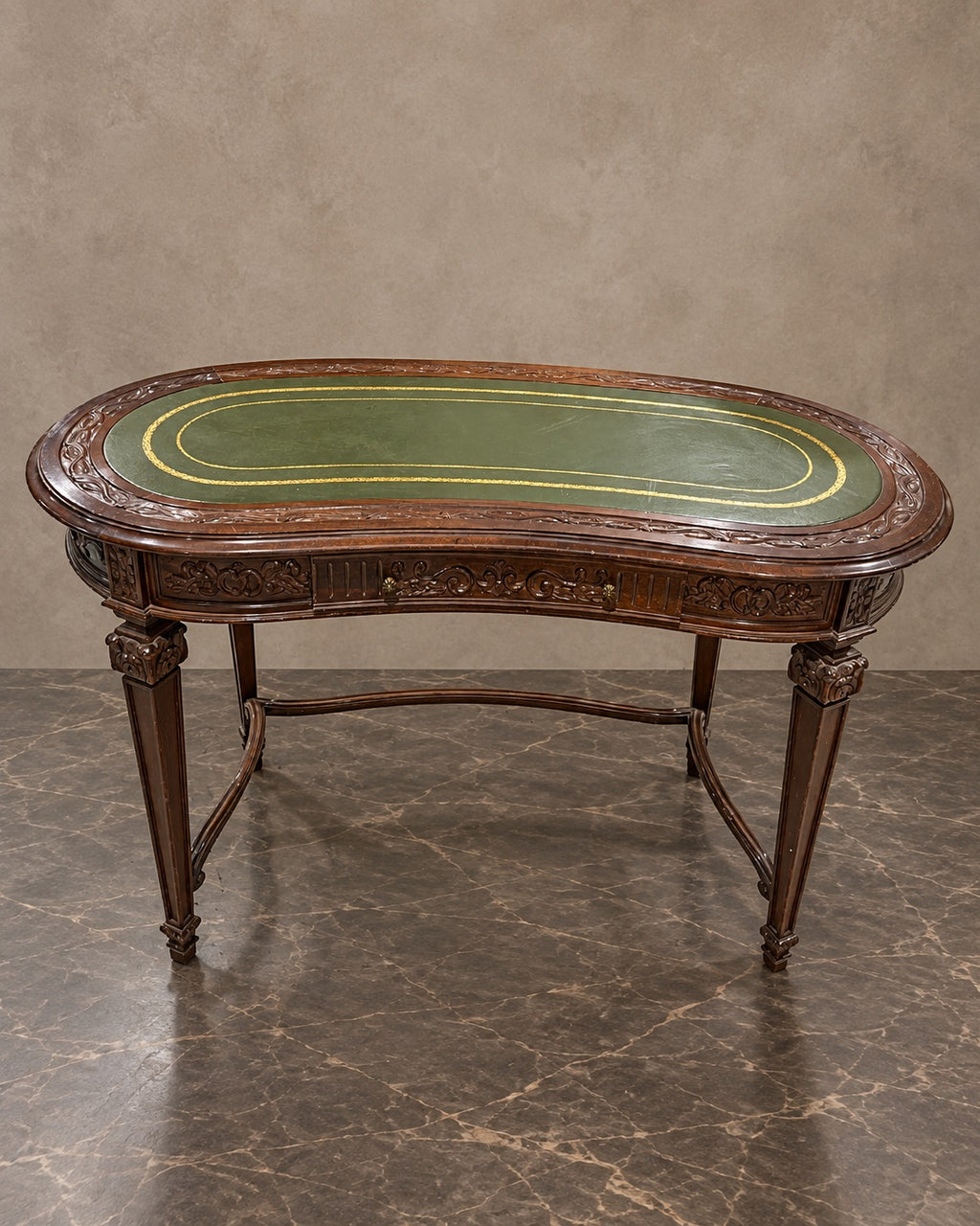 Carved Kidney-Shaped Writing Table in a styled setting