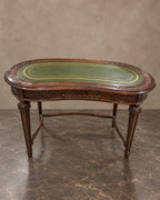 Carved Kidney-Shaped Writing Table in a styled setting