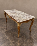 Gilt-Decorated Marble-Top Coffee Table in a styled setting