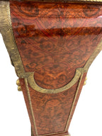 Pair of Bronze-Mounted Marble-Top Pedestals — original decorative panel and bronze mount detail on white