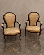 Pair of Floral-Upholstered Mahogany Armchairs in a styled setting