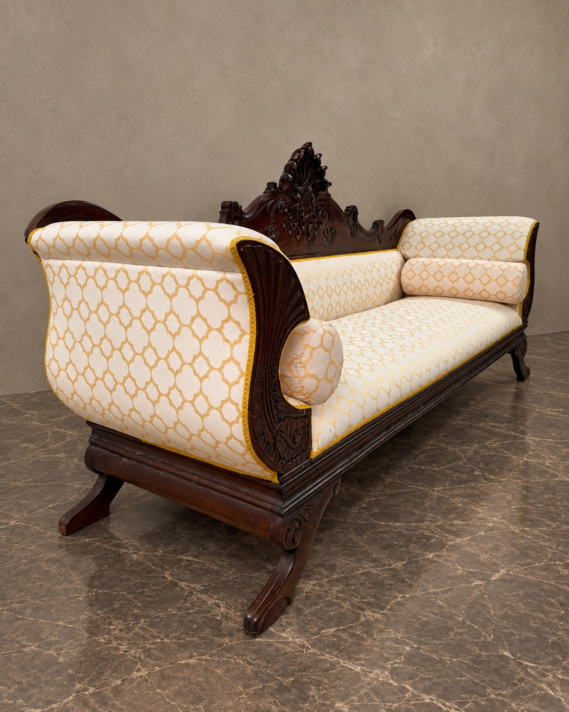 Carved Mahogany Sofa with Geometric Upholstery in a styled setting