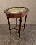 Oval Mahogany Table with Embroidered Glass Top in a styled setting