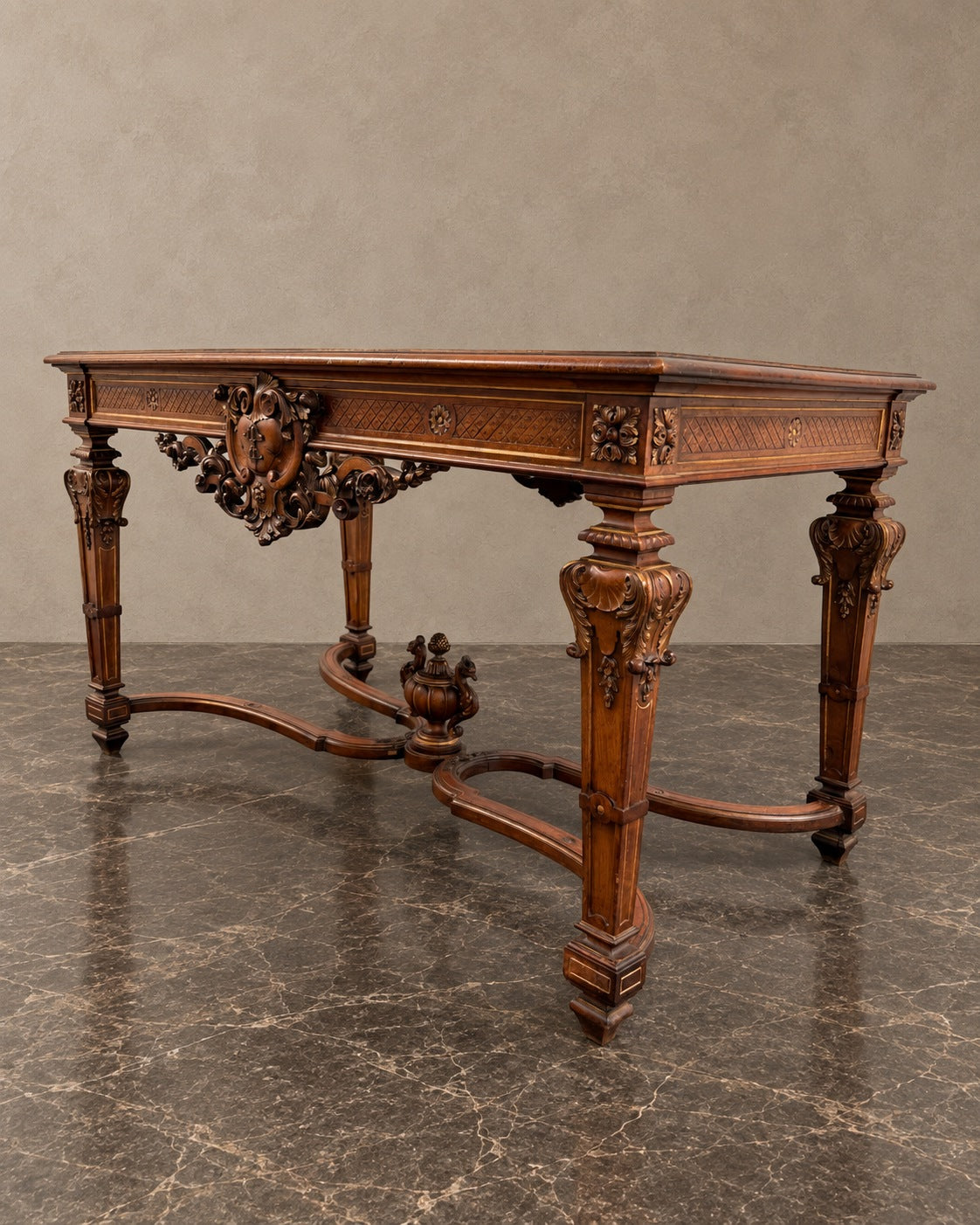 French Carved Table with Ornamental Stretcher in a styled setting