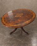 Oval Flame Mahogany Marquetry Table in a styled setting