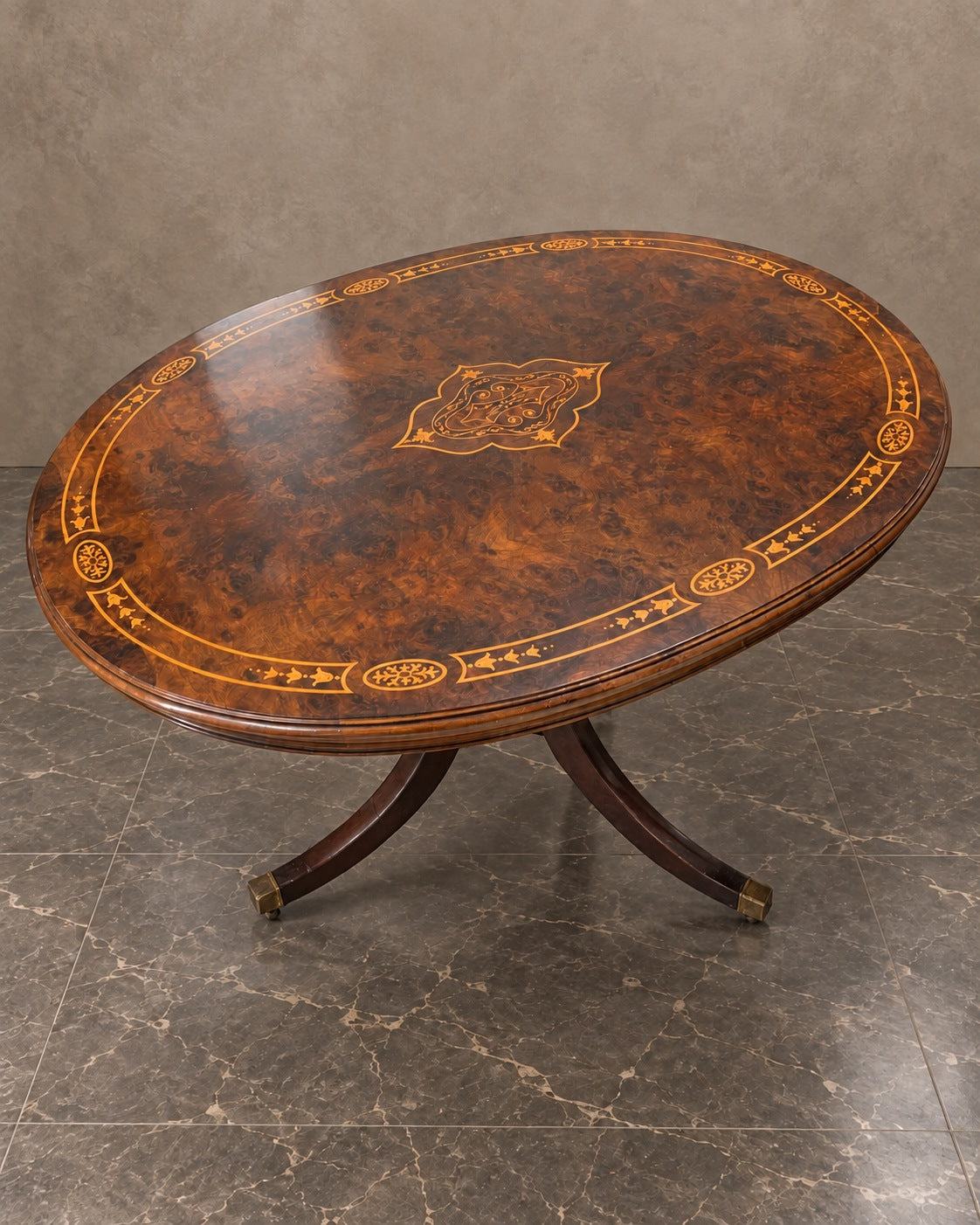 Oval Flame Mahogany Marquetry Table in a styled setting