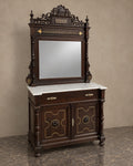 Carved Hall Cabinet with Mirror and Marble Top in a styled setting
