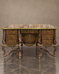 Ornate Metal-Inlaid Writing Desk in a styled setting