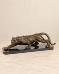 Crouching Panther Bronze Sculpture — primary view against a warm ivory background