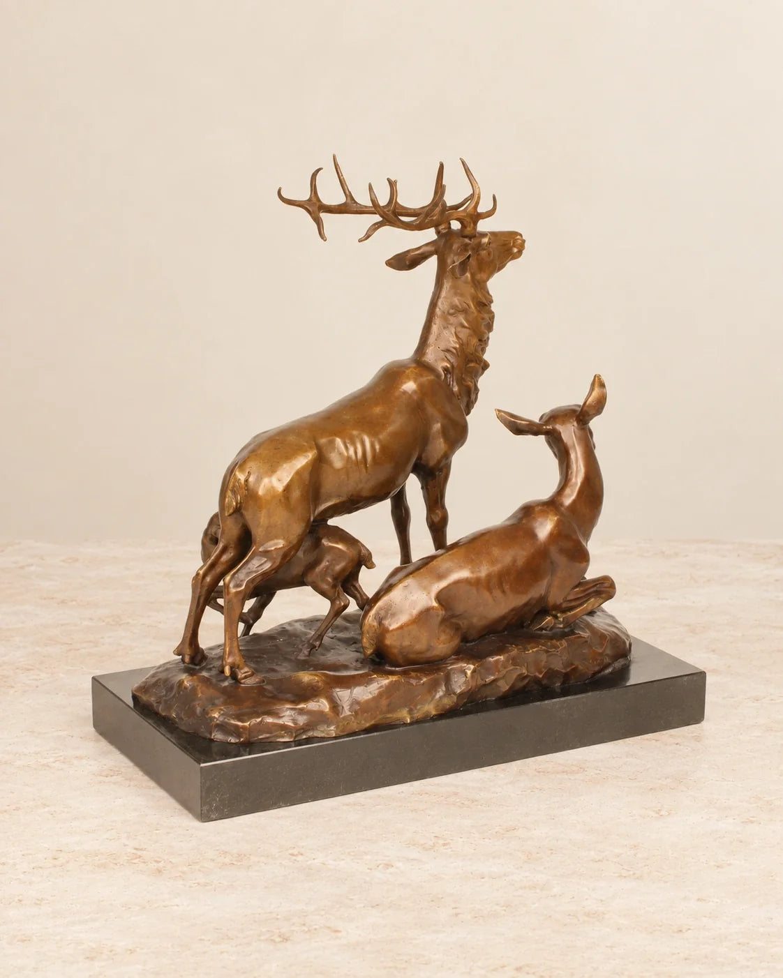 Deer Family Bronze Sculpture — second view against a warm ivory background