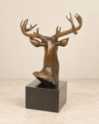 Deer Head Bronze Sculpture — second view against a warm ivory background