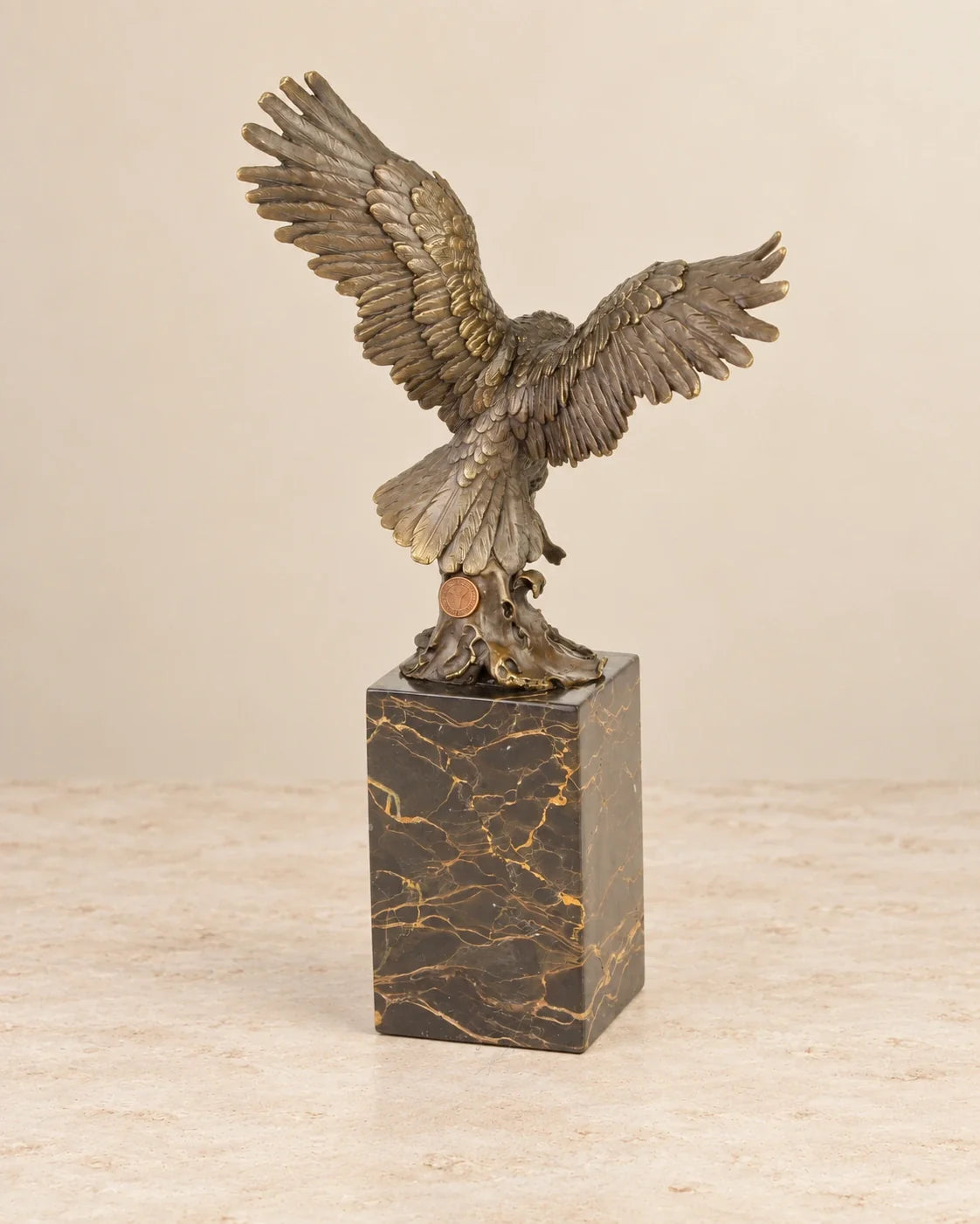 Fishing Eagle Bronze Sculpture — second view against a warm ivory background