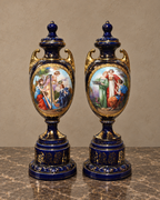 Pair of Sèvres-Style Cobalt Porcelain Urns with Musical Scenes — main view