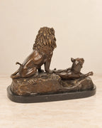 Lion and Lioness Bronze Sculpture — second view against a warm ivory background