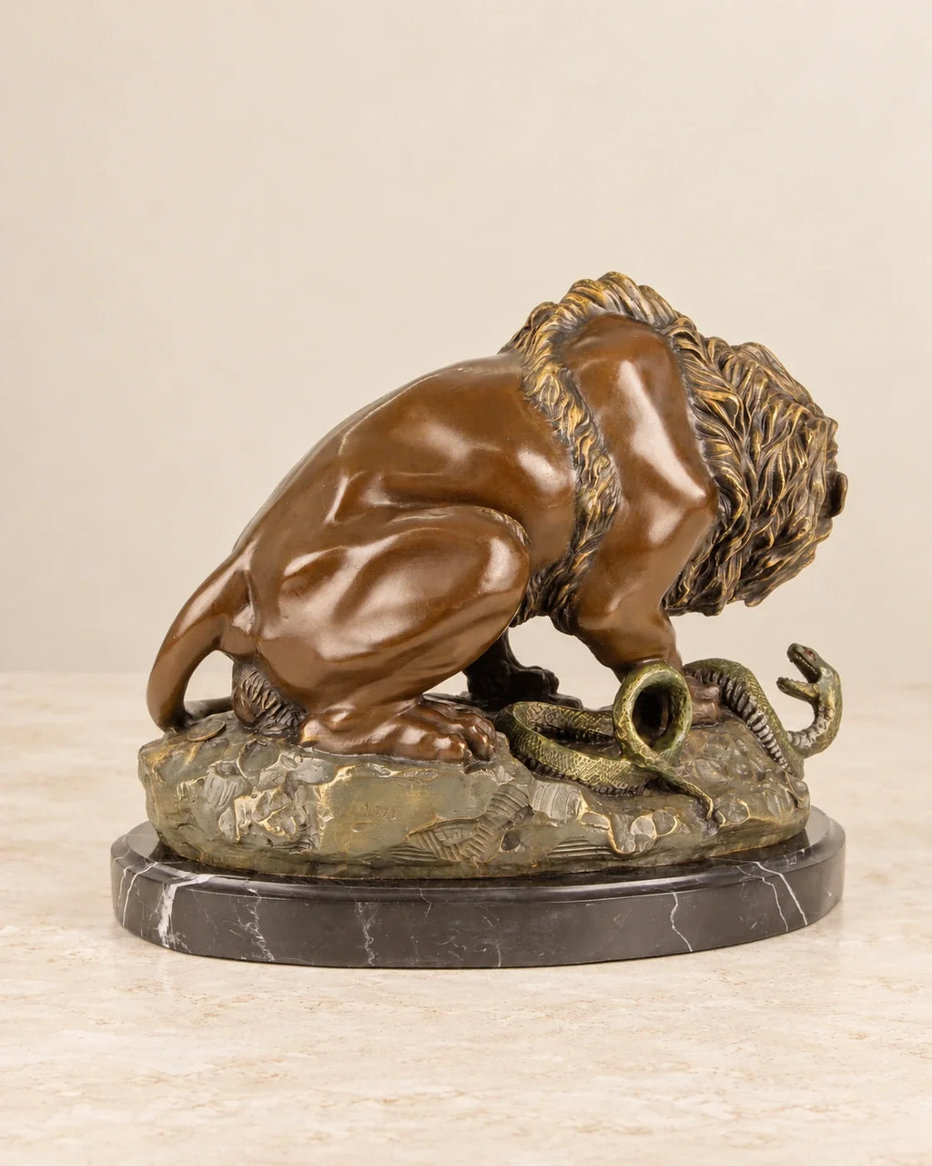 Lion and Serpent Bronze Sculpture — second view against a warm ivory background