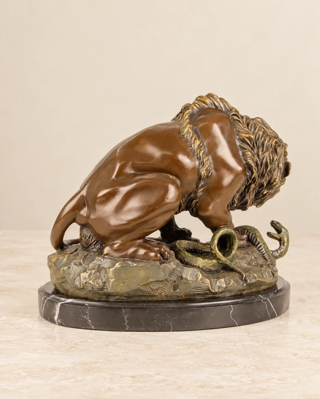 Lion and Serpent Bronze Sculpture — second view against a warm ivory background