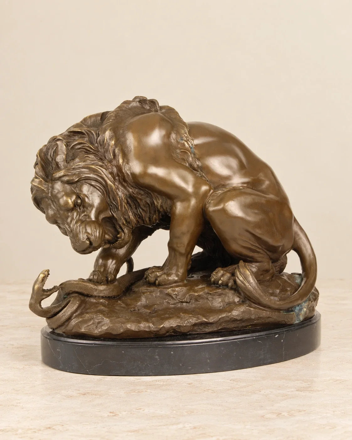 Lion and Serpent Bronze Sculpture — primary view against a warm ivory background