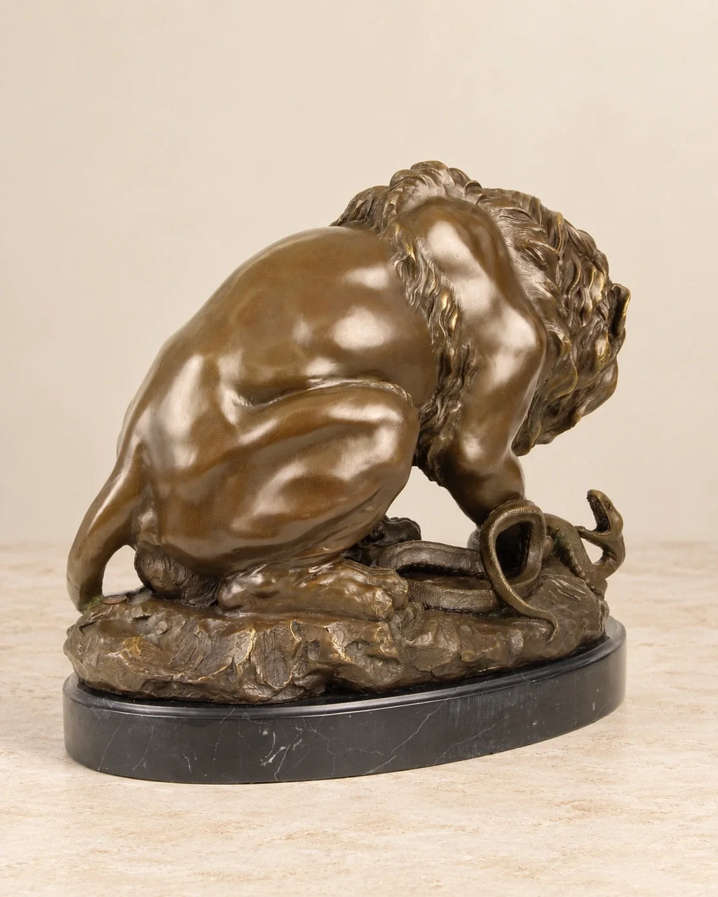Lion and Serpent Bronze Sculpture — second view against a warm ivory background