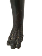Original close-up of the carved foot showing worn finish and small chips
