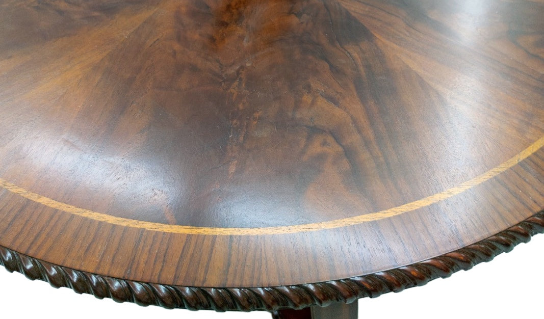 Original detail of the flame mahogany tabletop, inlaid border and carved edge