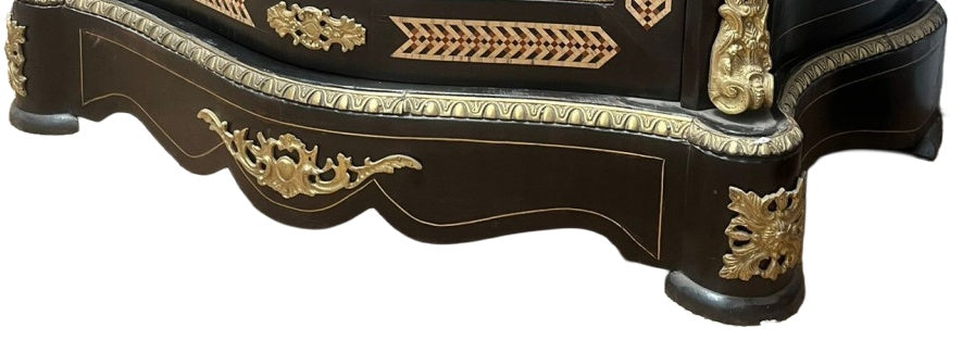 Original detail of the display cabinet base, marquetry, gilt mounts and surface wear