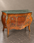 French marquetry chest with green marble top and bronze mounts in a styled setting