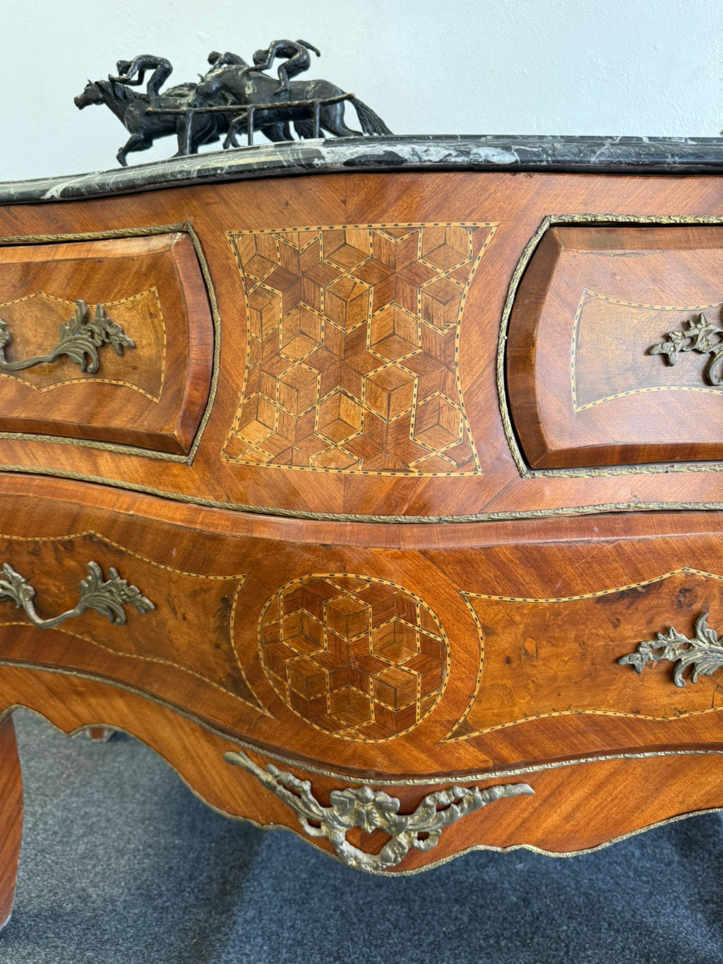 Original close-up of the marquetry and bronze mounts