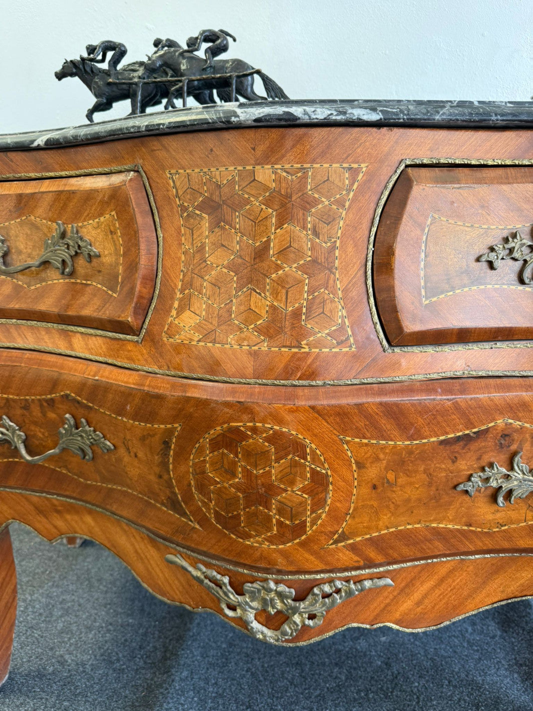 Original close-up of the marquetry and bronze mounts