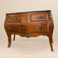 Marquetry chest of drawers with black marble top — front view