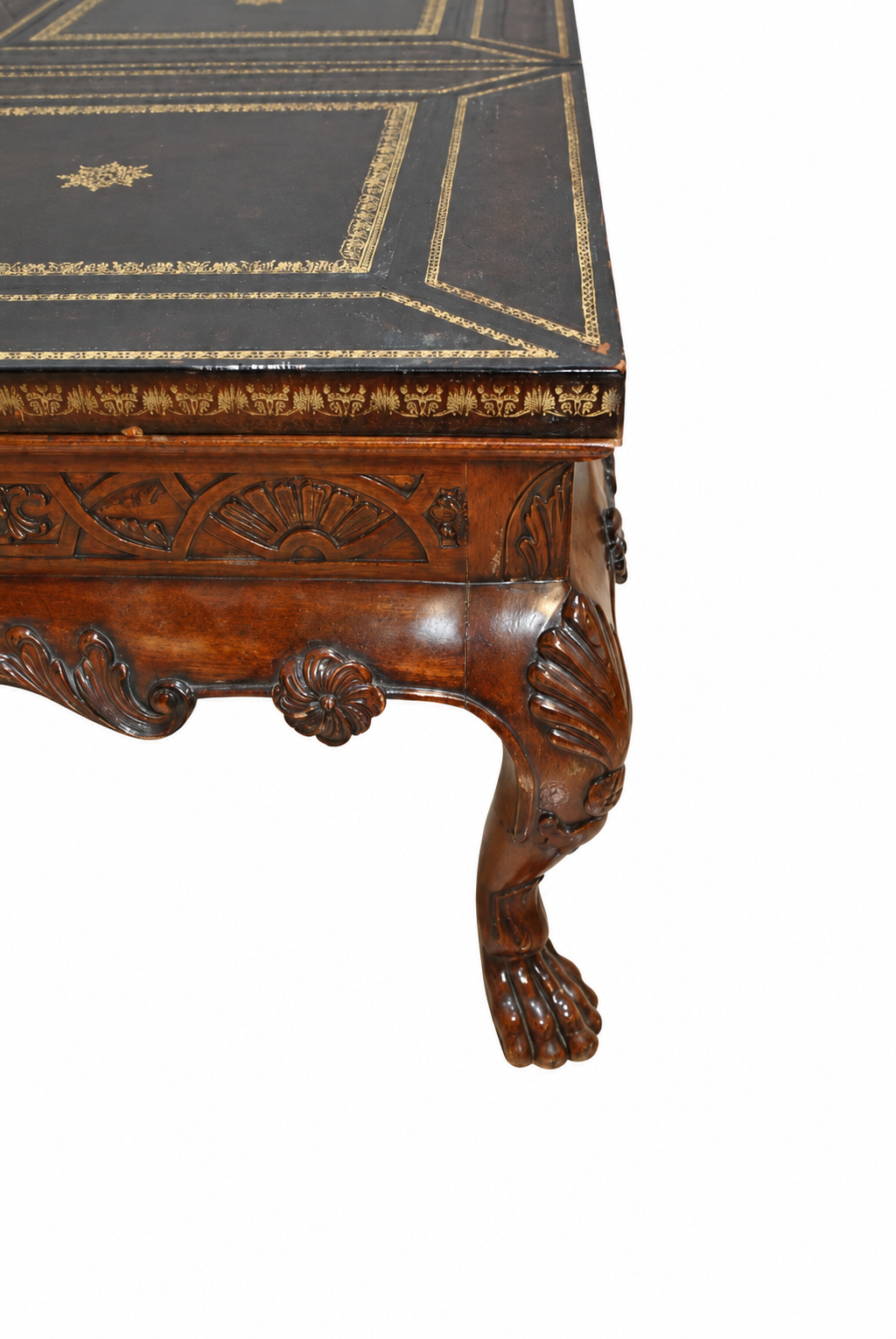 Carved Mahogany Coffee Table with Gilt-Tooled Leather Top — detail on white background