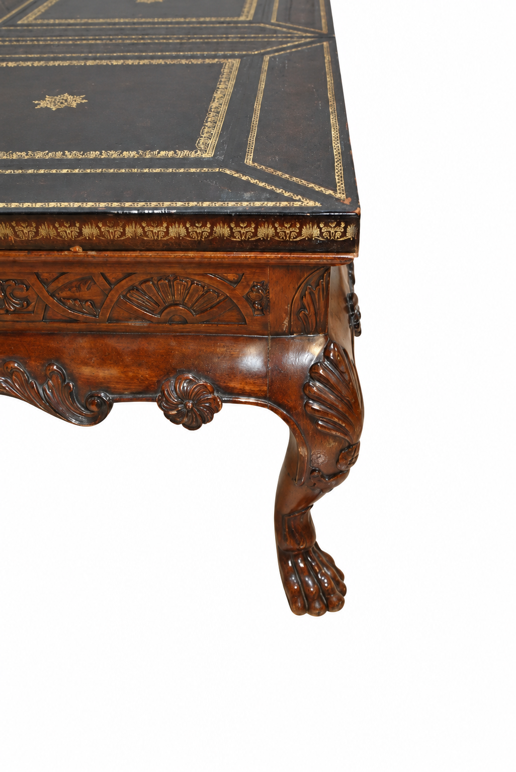 Carved Mahogany Coffee Table with Gilt-Tooled Leather Top — detail on white background