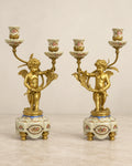 Pair of Porcelain Cherub Candelabra
