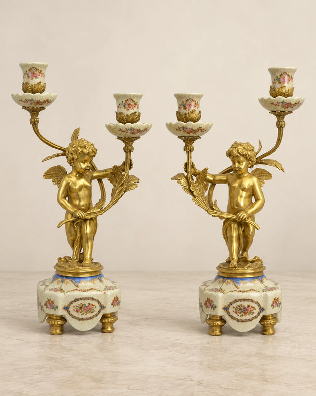 Pair of Porcelain Cherub Candelabra