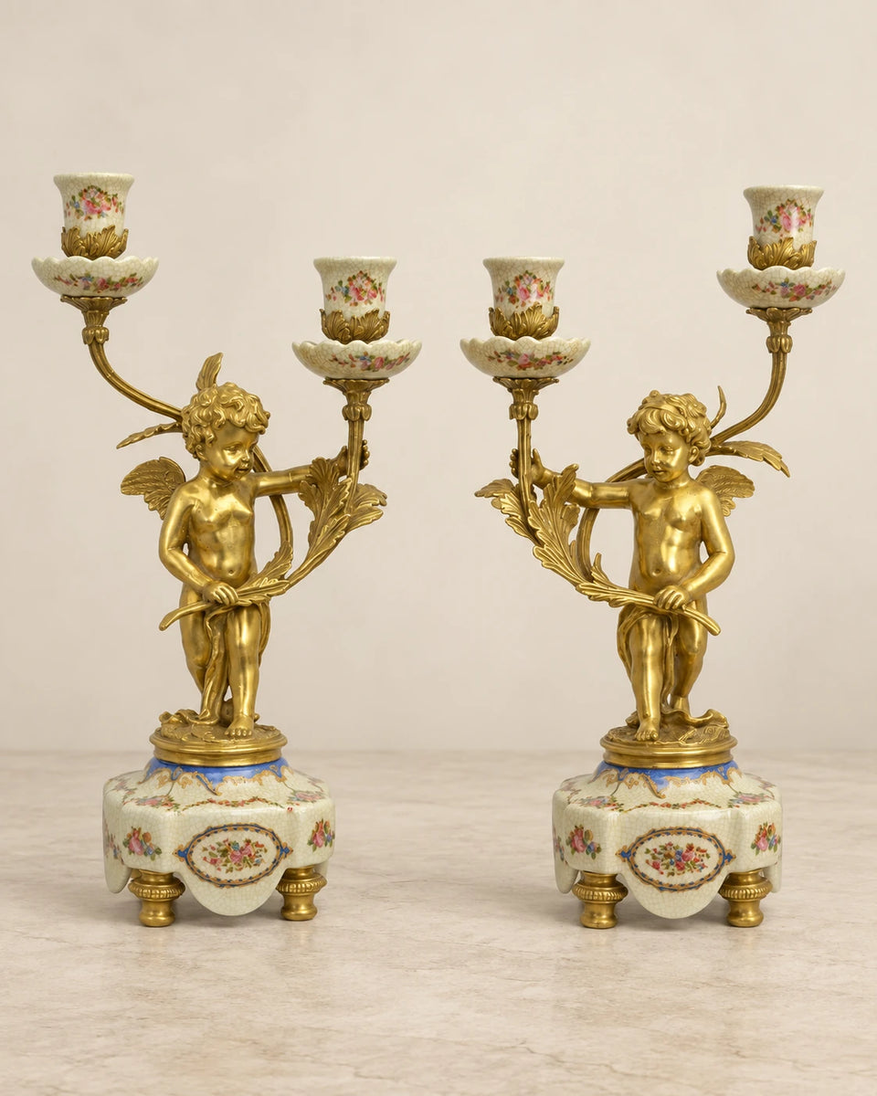 Pair of Porcelain Cherub Candelabra