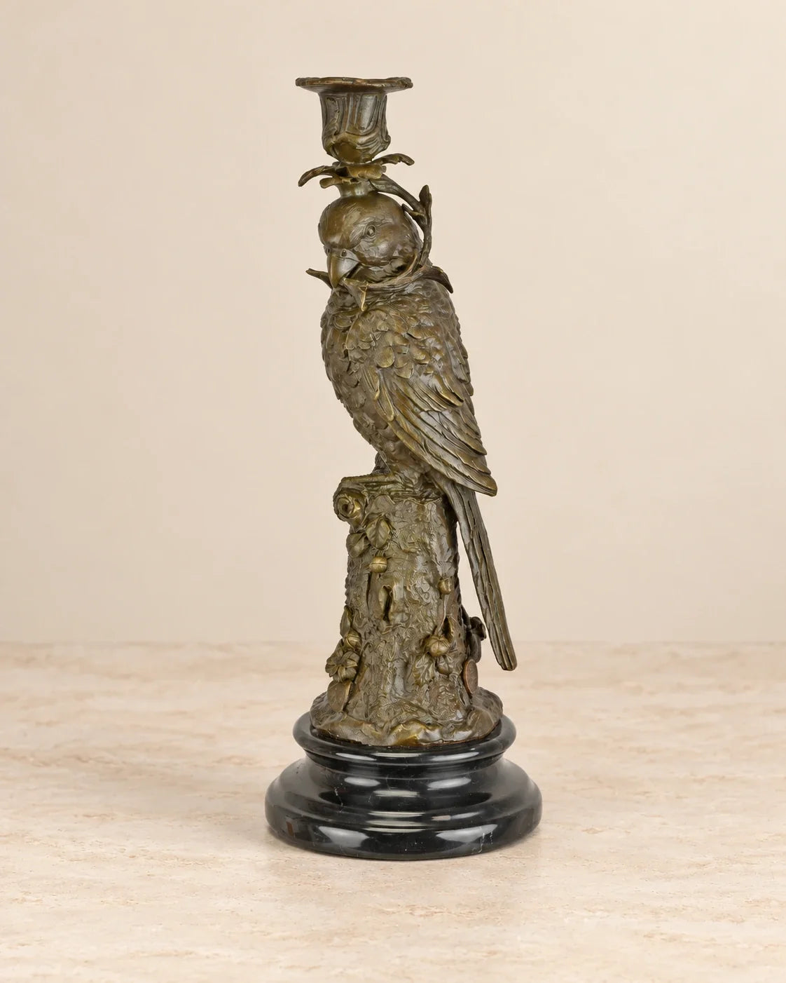 Parrot Bronze Candle Holder — primary view against a warm ivory background