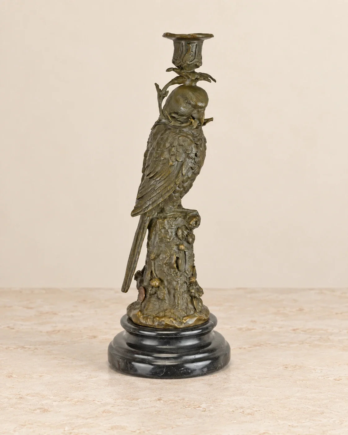 Parrot Bronze Candle Holder — primary view against a warm ivory background