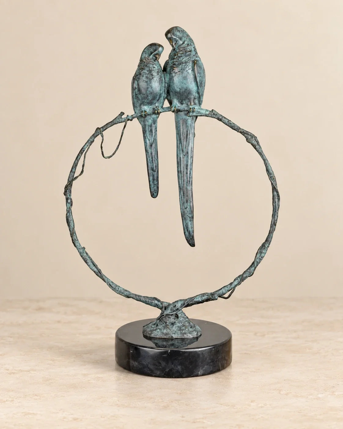 Parrots on a Branch Bronze Sculpture — primary view against a warm ivory background