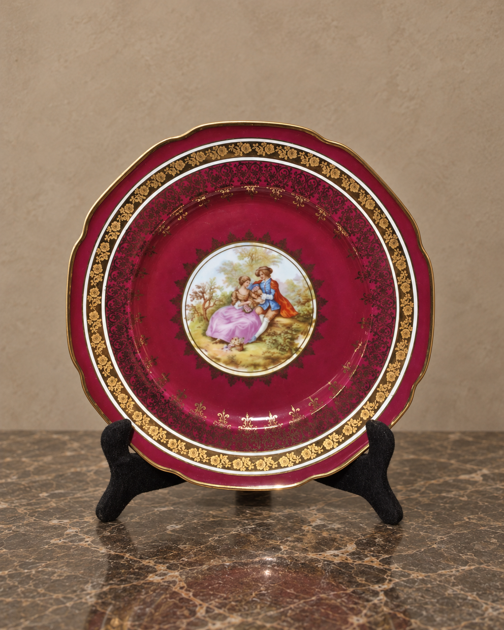 Burgundy and Gilt Porcelain Plate with Romantic Scene — main view