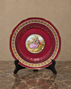 Burgundy and Gilt Porcelain Plate with Romantic Scene — main view