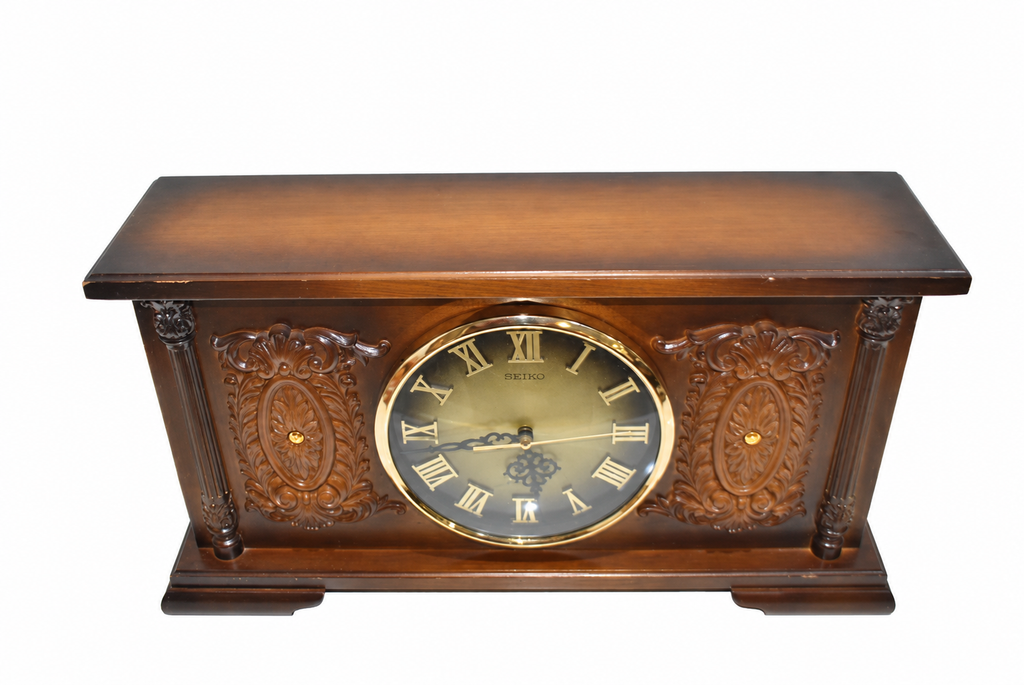 Carved Wooden Mantel Clock with Gold-Tone Dial — detail on white background