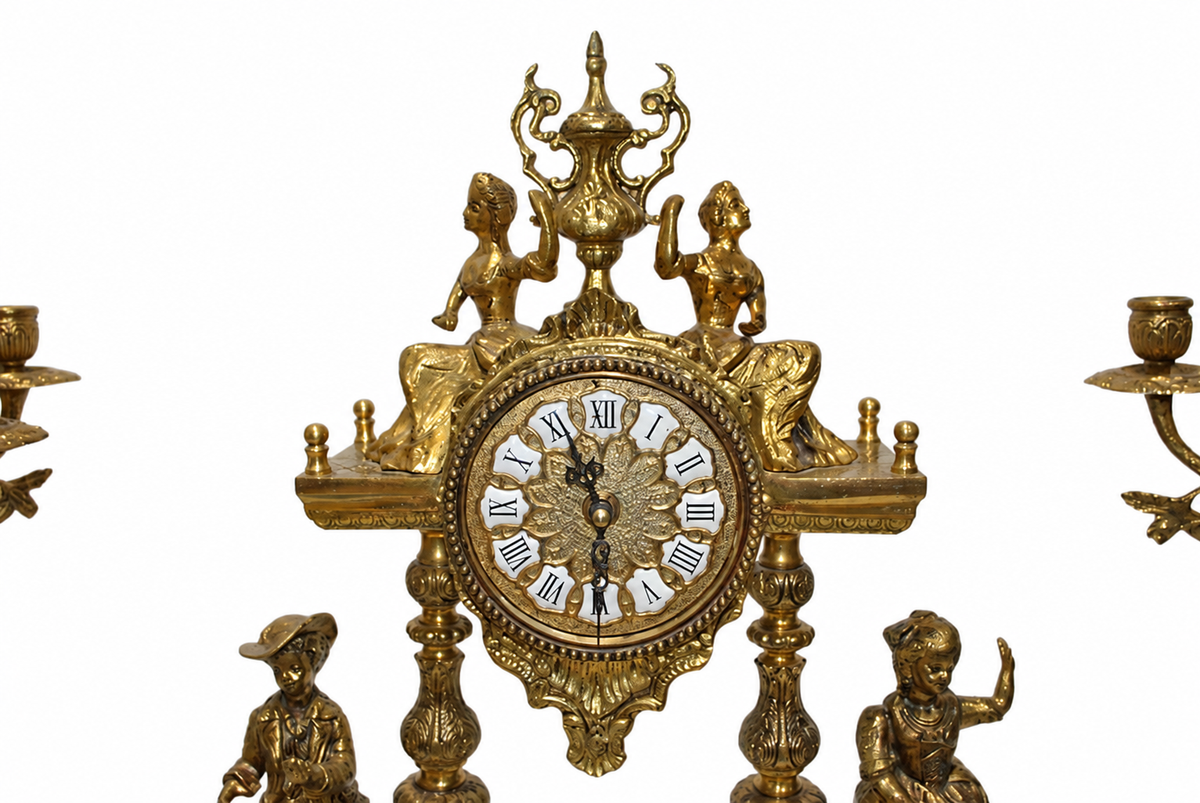 Gilt-Bronze Figural Clock and Candelabra Garniture — detail on white background