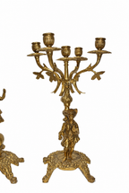 Gilt-Bronze Figural Clock and Candelabra Garniture — detail on white background