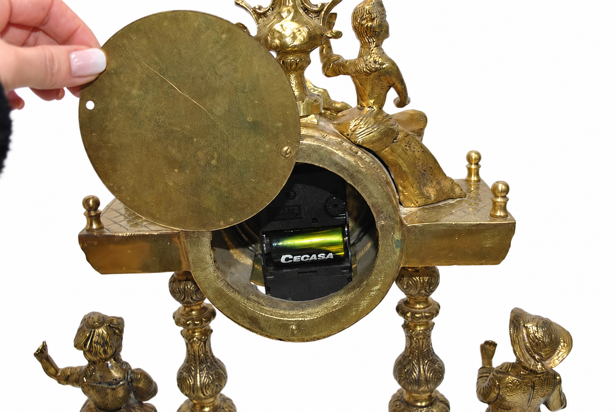 Gilt-Bronze Figural Clock and Candelabra Garniture — detail on white background