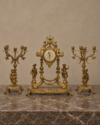 Gilt-Bronze Figural Clock and Candelabra Garniture — main view