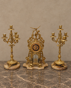 Gilt-Bronze Cherub Clock and Candelabra on Brown Marble — main view