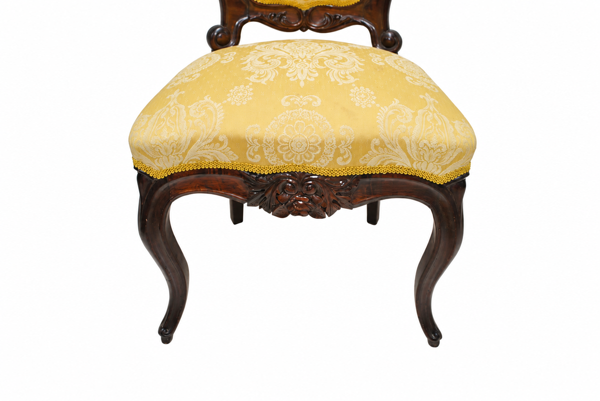 Set of Six Isabelino-Style Mahogany Chairs with Yellow Damask — detail on white background