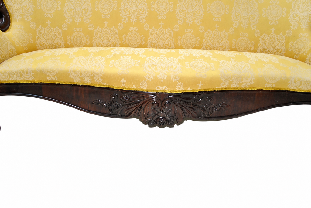 Carved Isabelino-Style Mahogany Sofa with Yellow Silk Damask — detail on white background