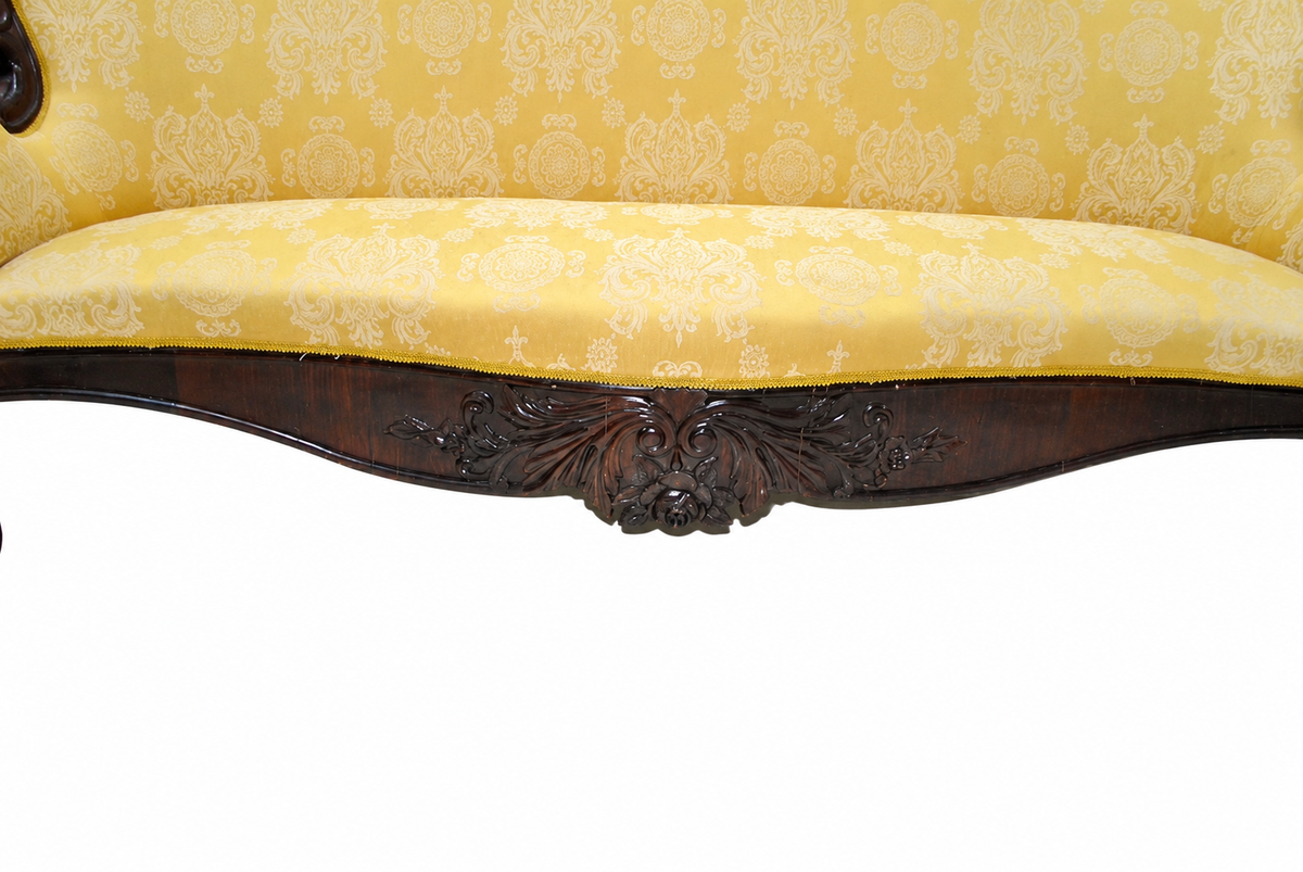 Carved Isabelino-Style Mahogany Sofa with Yellow Silk Damask — detail on white background