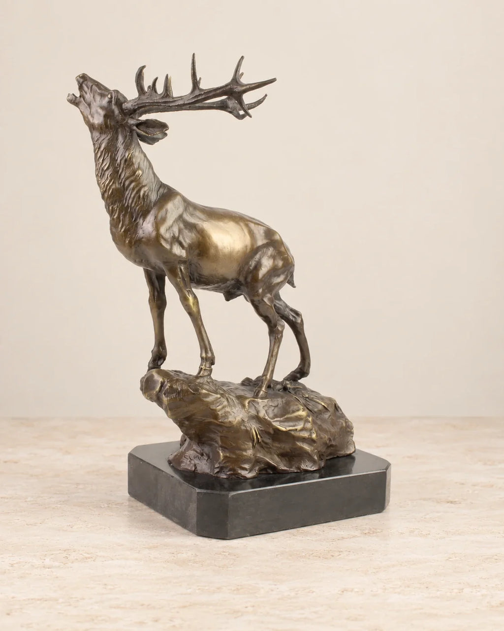 Stag on a Rock Bronze Sculpture — 37.8 cm Tall — second view against a warm ivory background