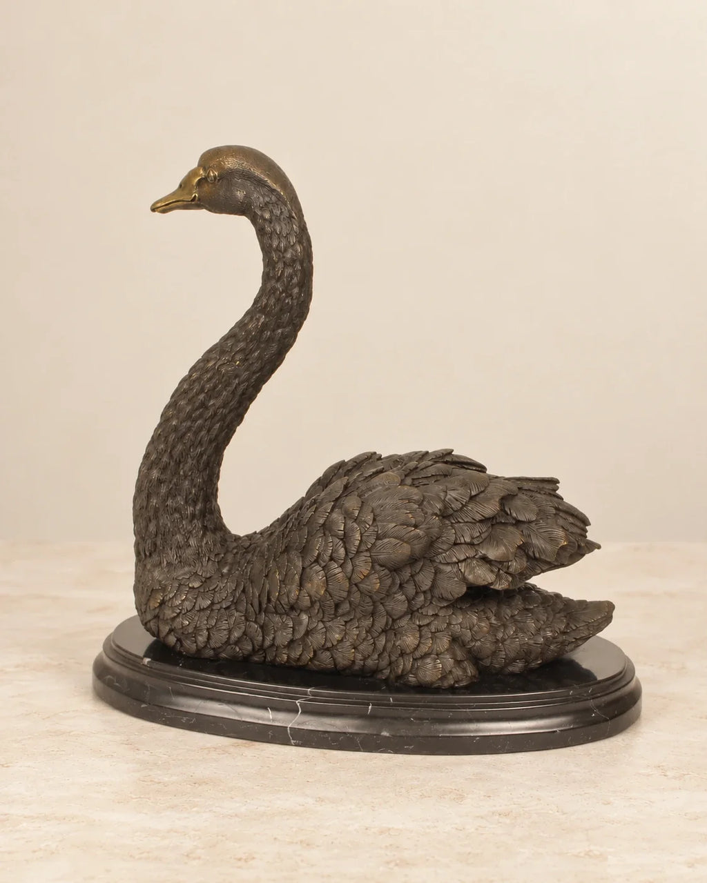 Swan Bronze Sculpture — second view against a warm ivory background